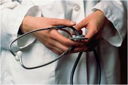 A doctors hands holding a stethoscope