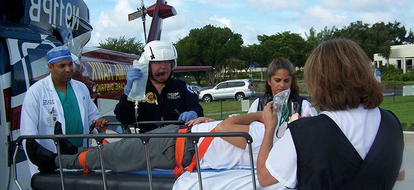 A patient being wheeled out of the Trauma Hawk on a gurney